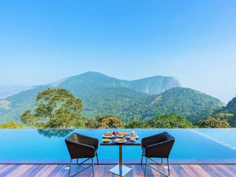 Chair near Infinity pool at the best resort in Munnar