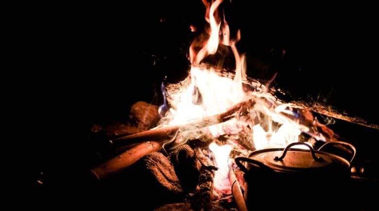 Bonfire facilities in Munnar Kerala: Best Resorts Guide 7 Guests enjoying outdoor barbecue around a bonfire at Shola Crown Resort — premium bonfire facilities in Munnar Kerala.