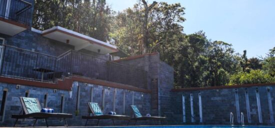 Scenic mountain route representing the Kochi Airport to Shola Crown Fare with lush forests and winding roads.