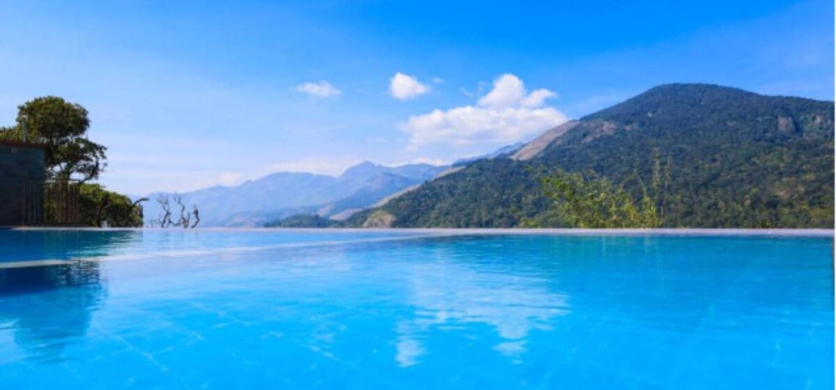 Infinity Pool Resort Munnar – Shola Crown Resort with stunning valley views and cloud-touching water experience.